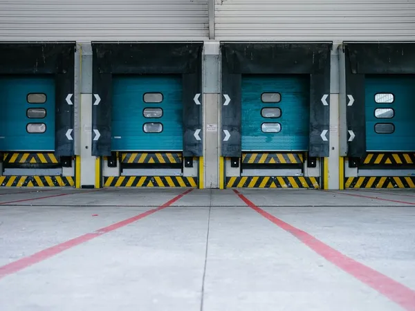 Loading dock with overhead doors, levelers, and dock seals